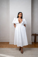 Detailed shot of white midi dress and puff sleeve
