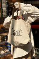 Side shot of model shopping in casual everyday tote bag