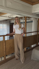 Fashion-focused crop highlighting model’s torso and sleeves